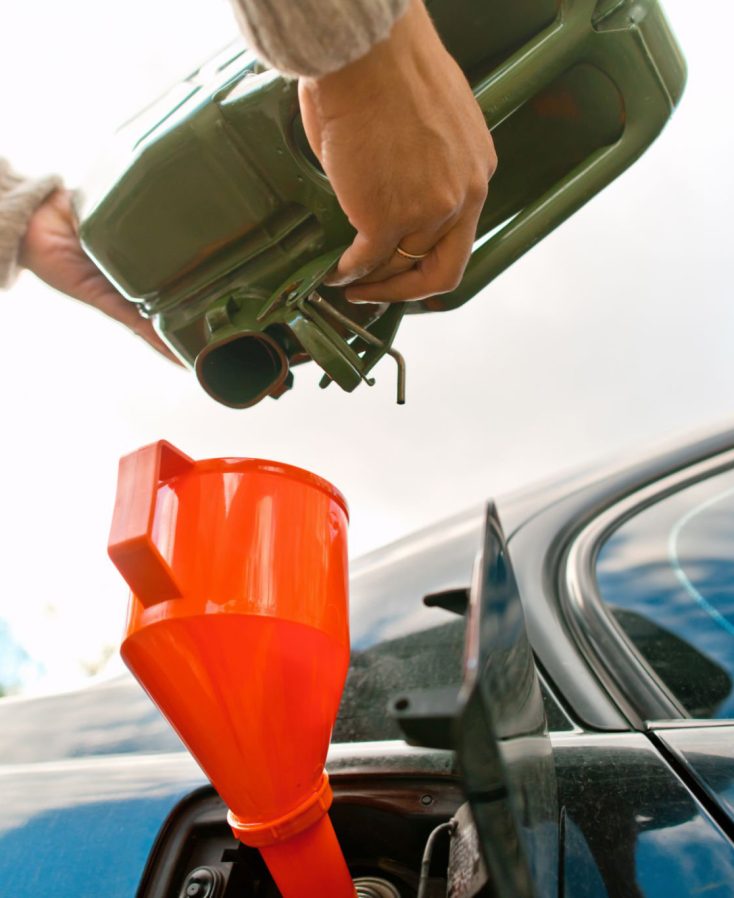 Man's hands with empty fuel canister. Energy crisis and high fuel prices concept.